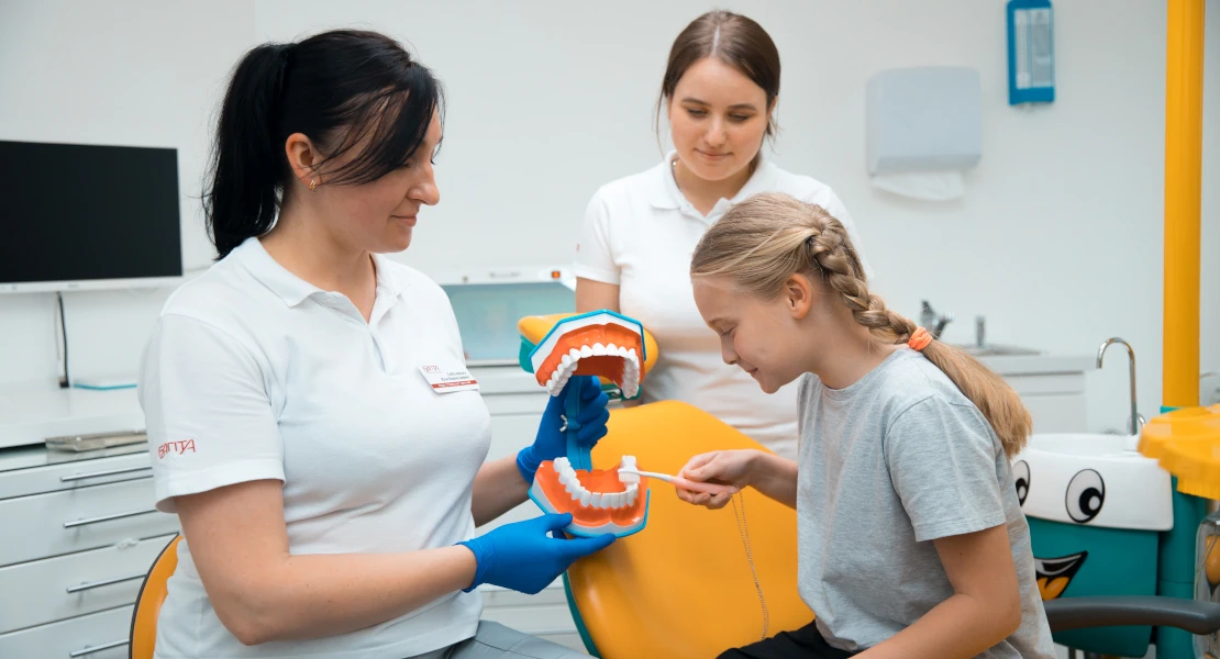 photo shows a child at the dentist's office getting his teeth treated