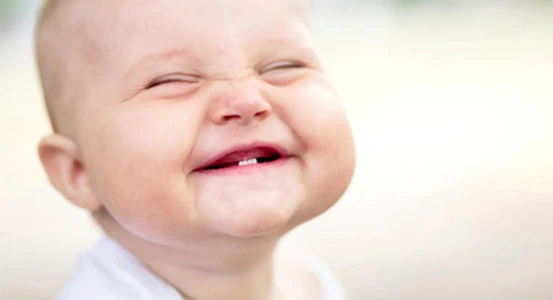 a picture of a baby with one tooth