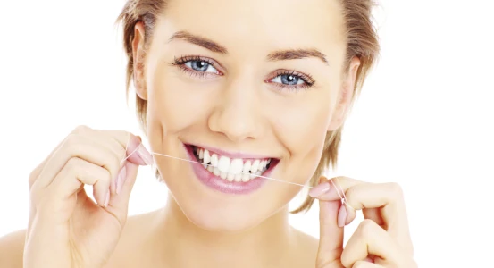 photo of a girl with dental floss for dental hygiene after a filling at Bagita Clinic in Cherkassy